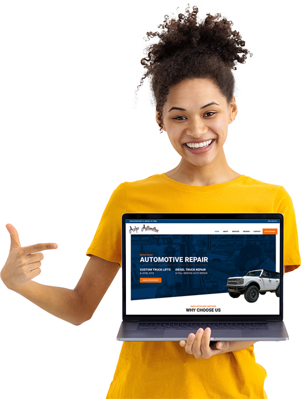 Woman holding laptop with AMG website